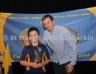 Under 10 Football Skills Winner Rory Kelly receives his award from Senior Football Captain Paul Doherty